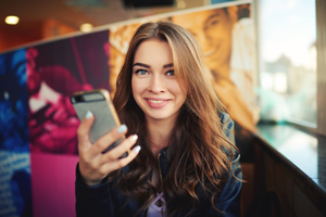 Girl getting an alert on her cell phone